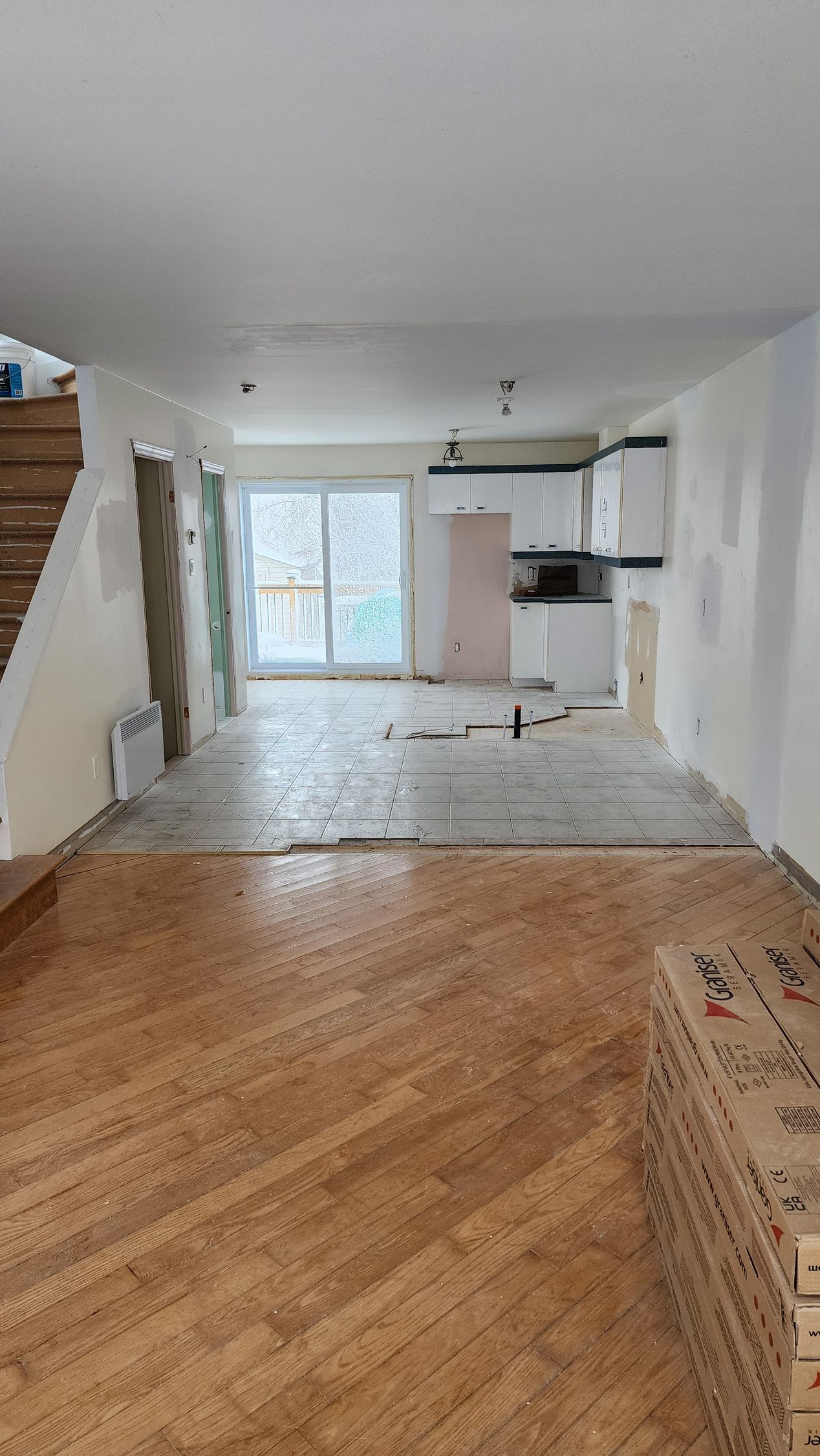There is a wooden floor in the middle of the room.