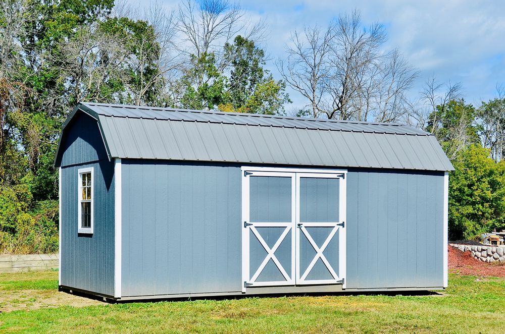 Blue Barn Shed With White Trim, Arched Roof, and Double Doors — ShedBoss in Tolga, QLD