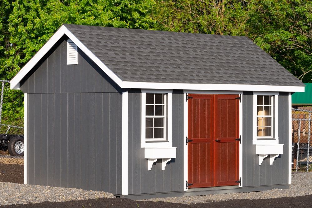 Gray Shed With White Trim, Dark Red Doors, and Two Windows — ShedBoss in Atherton, QLD