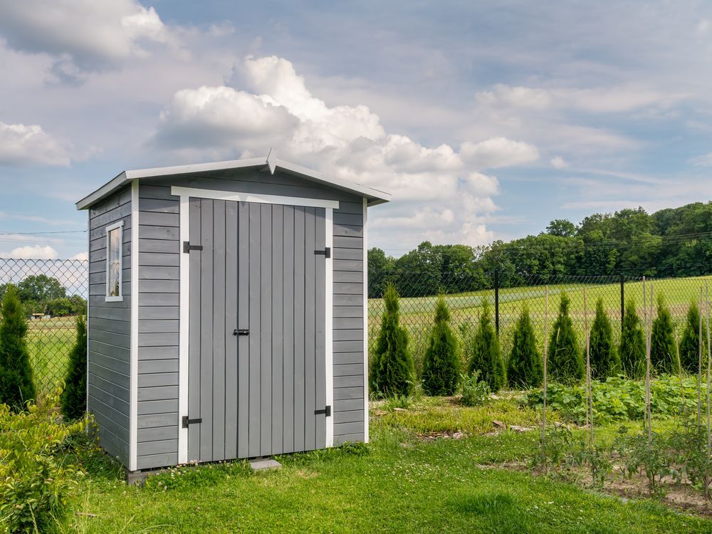 Gray Wooden Shed in a Grassy Yard — ShedBoss in Atherton, QLD