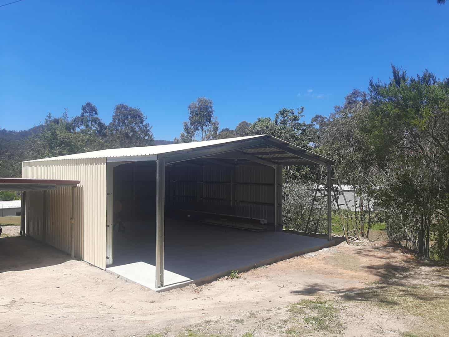 Tan Metal Shed With Open Carports — ShedBoss in Atherton, QLD