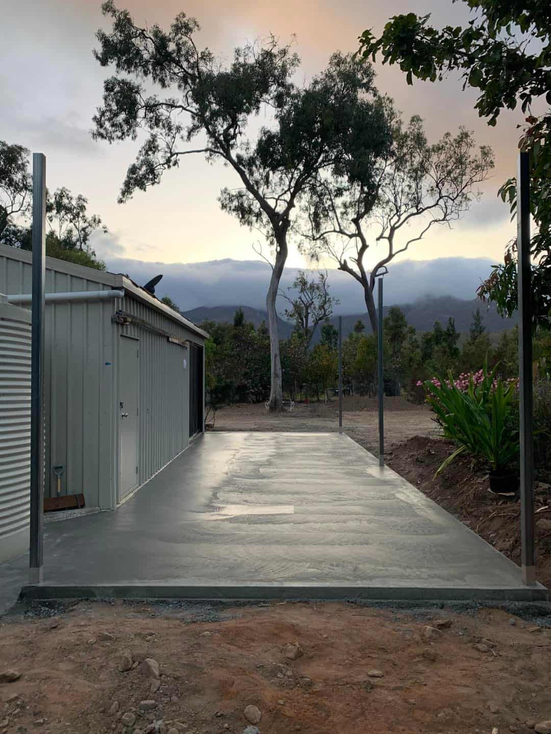 Concrete Driveway Leading to a Metal Shed — ShedBoss in Atherton, QLD