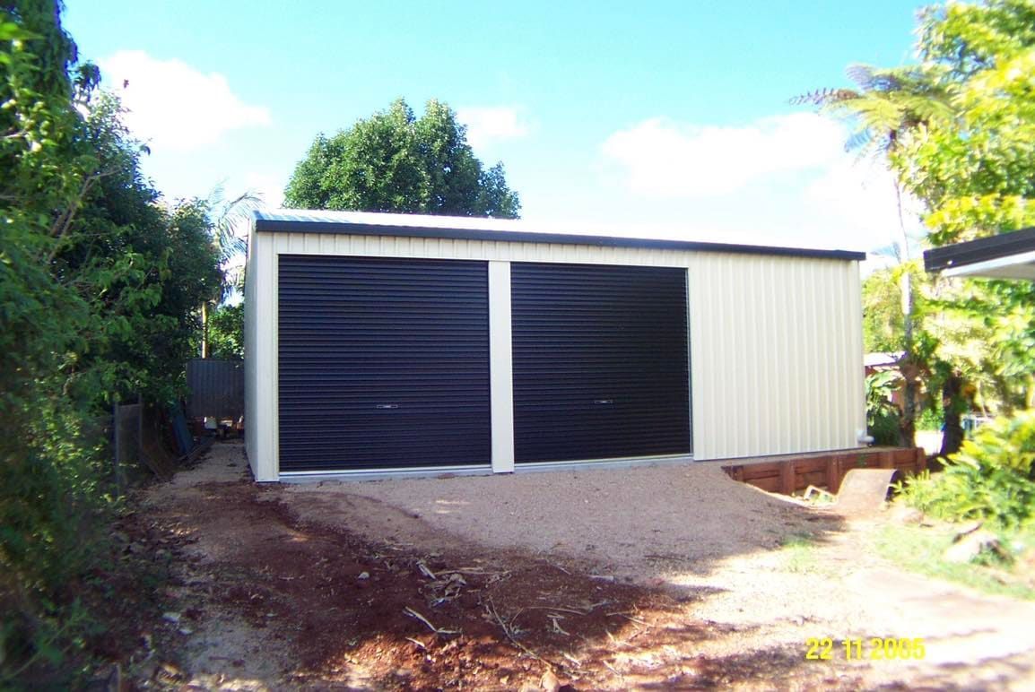 Two-car Garage With Black Doors and Beige Siding — ShedBoss in Atherton, QLD