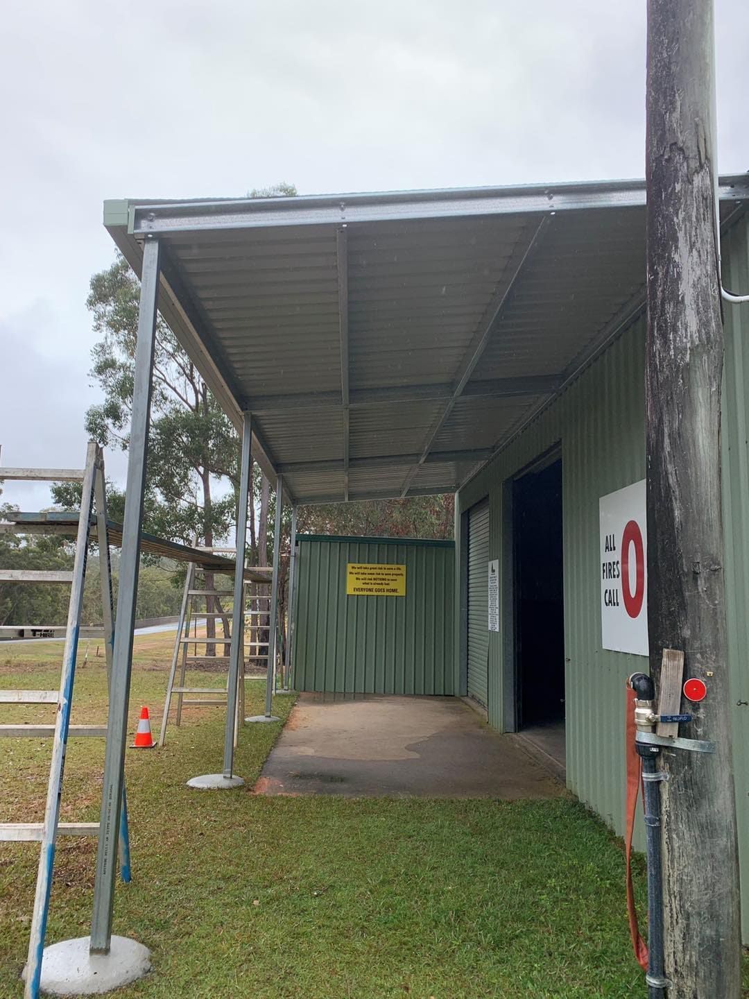 Green Building With Covered Walkway — ShedBoss in Atherton, QLD