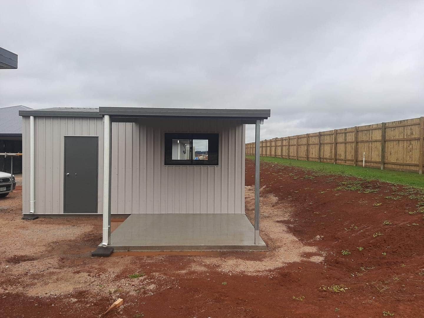 Small Gray Shed With a Porch and a Window — ShedBoss in Atherton, QLD