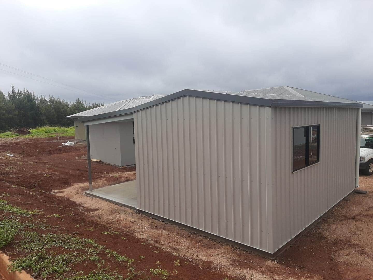 Gray Metal Shed Building With a Small Window — ShedBoss in Atherton, QLD