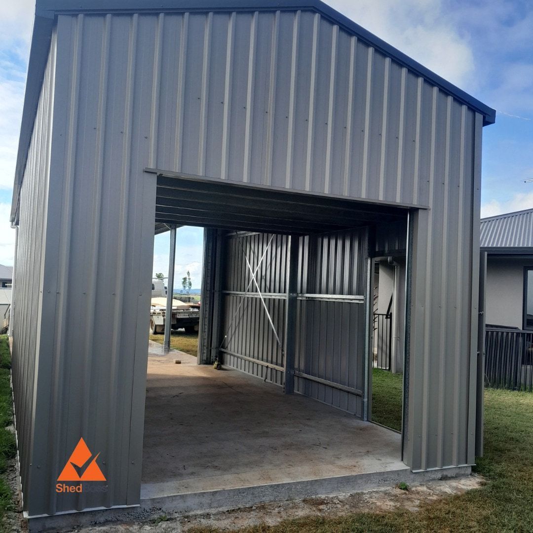 Gray Metal Shed With Open Entrance on Concrete Base, Outdoors — ShedBoss in Atherton, QLD