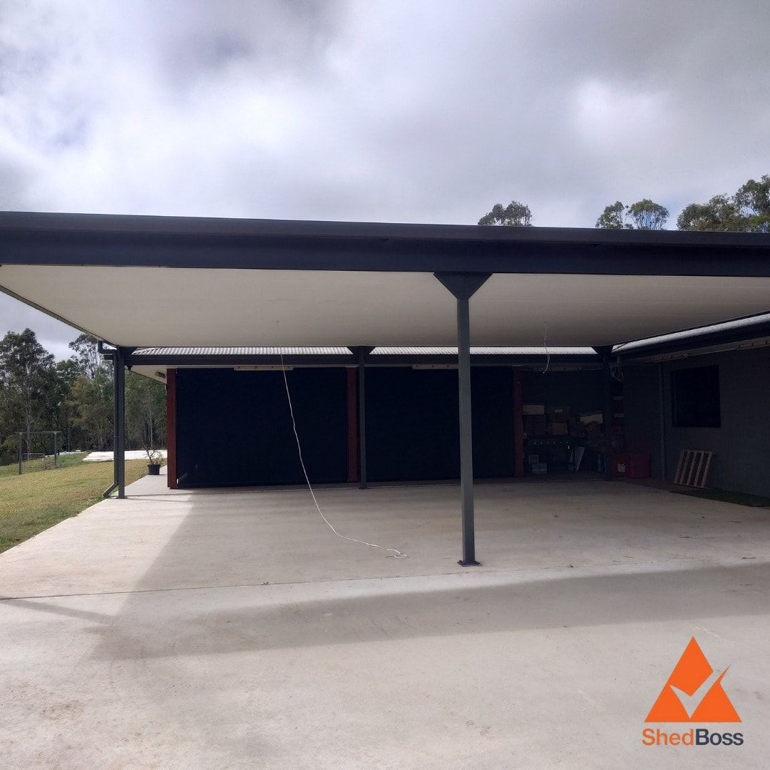 Carport With a White Roof and Black Trim, Over a Concrete Driveway — ShedBoss in Atherton, QLD