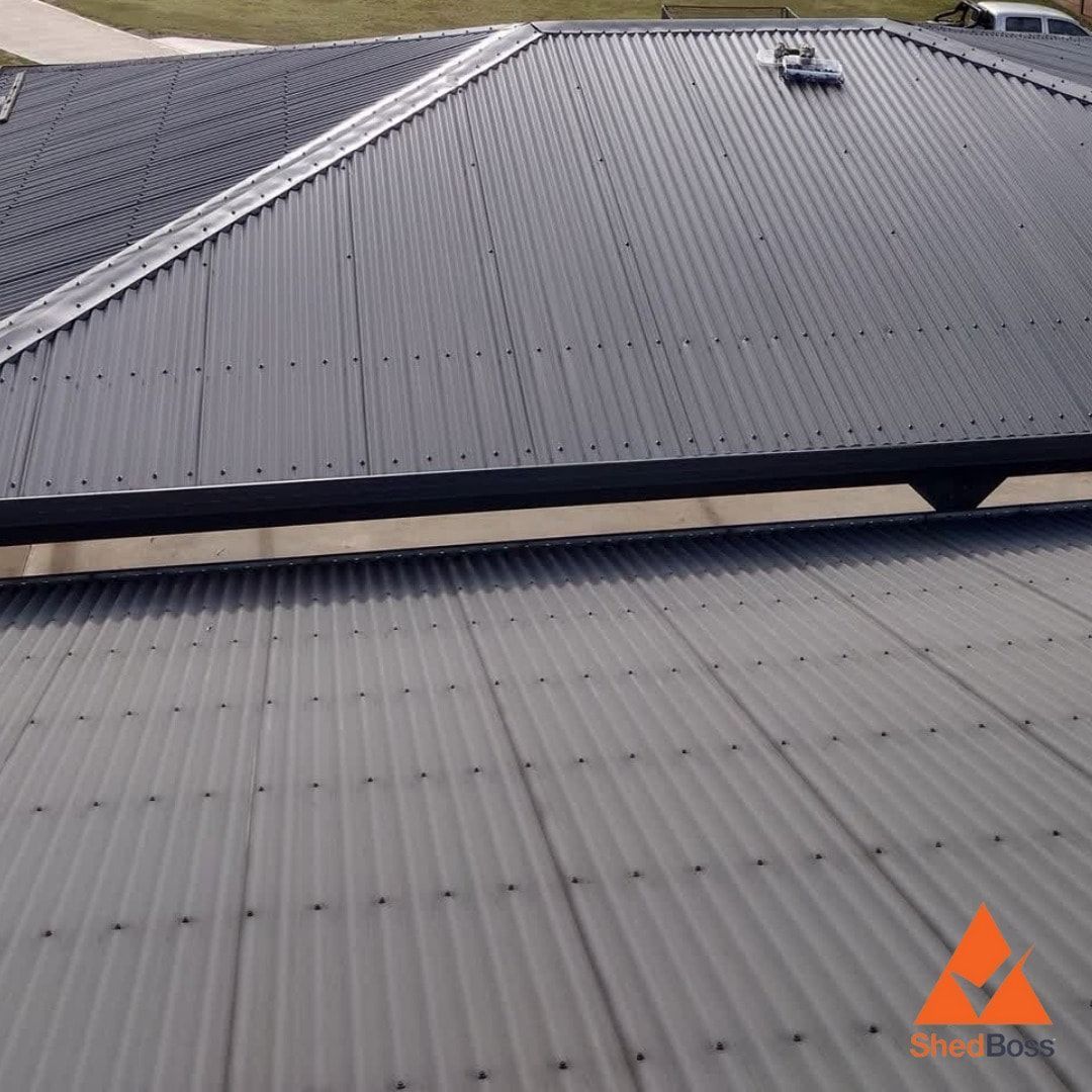 Grey Metal Roof With Corrugated Texture, Skylight, and Visible Fasteners — ShedBoss in Atherton, QLD