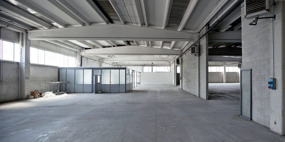 Spacious, Empty Industrial Interior With Concrete Floors, Ceilings, and Walls — ShedBoss in Mareeba, QLD