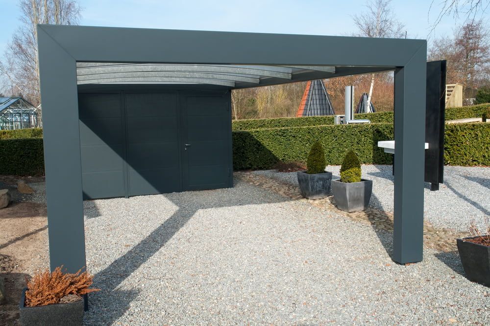 Modern Gray Pergola With a Door and Gravel Ground — ShedBoss in Mareeba, QLD