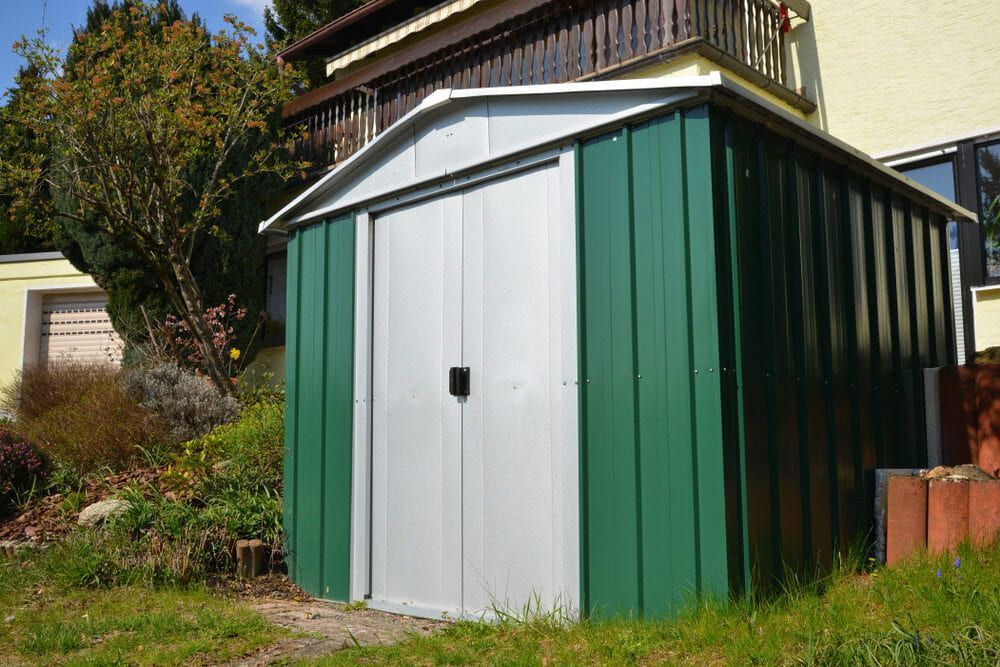 Green and Silver Metal Storage Shed in a Grassy Yard — ShedBoss in Mareeba, QLD
