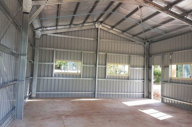 Empty Metal-walled Shed Interior With Windows — ShedBoss in Atherton, QLD