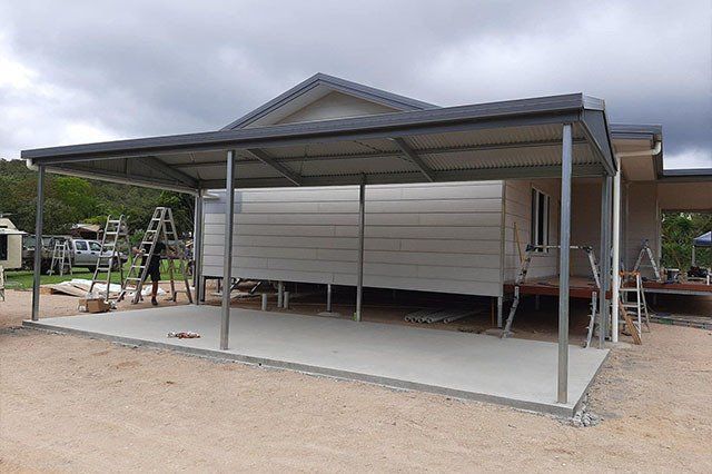 Carport Construction Attached to a House With Concrete Slab — ShedBoss in Atherton, QLD