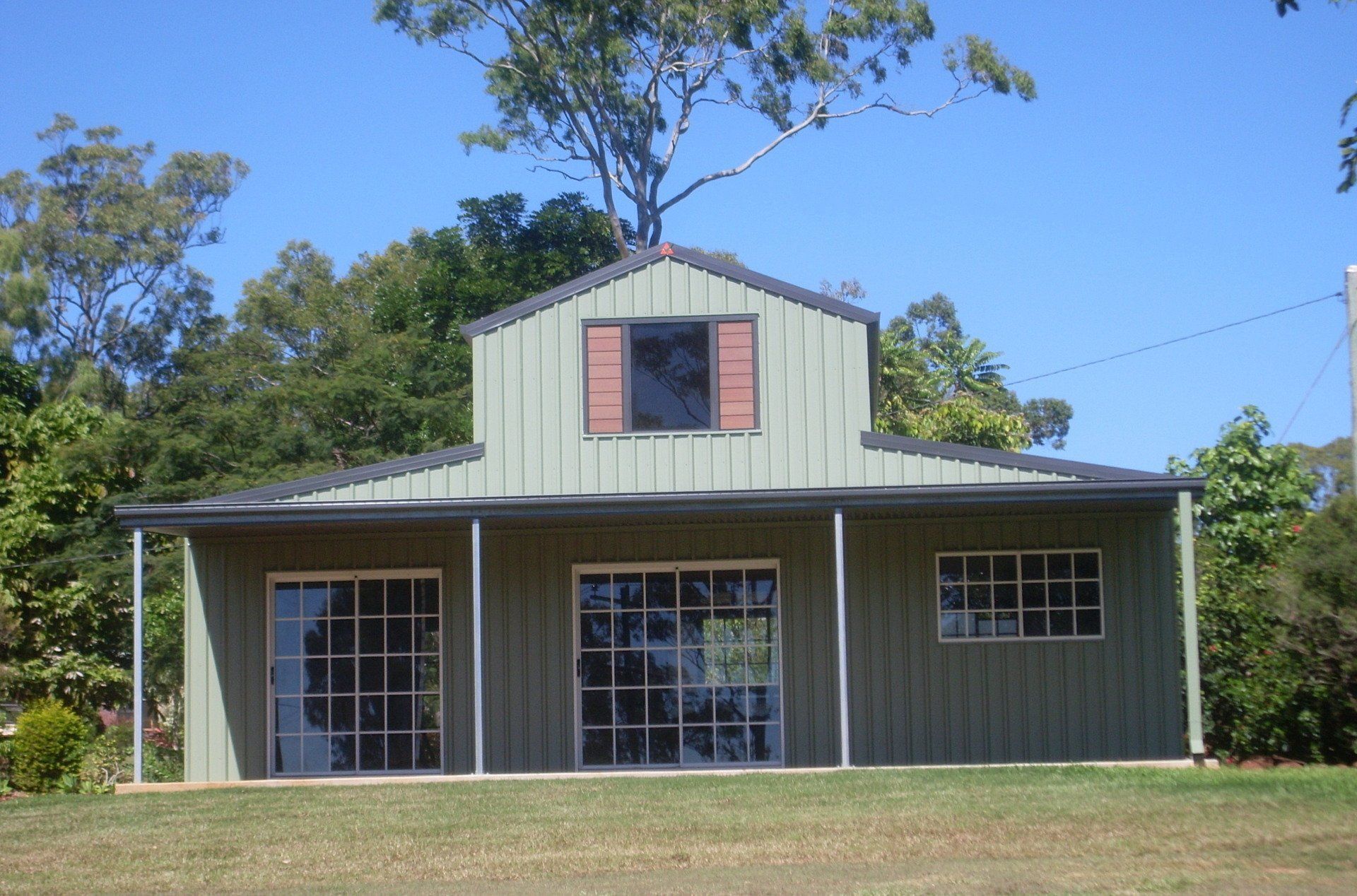 Green Metal Building With a Dark Roof and a Gable — ShedBoss in Atherton, QLD