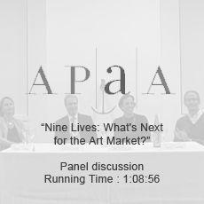 A group of people are sitting at a table having a panel discussion.