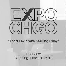 A black and white photo of an interview with todd levin with sterling ruby.