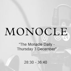 A black and white photo of a microphone with the word monocle on it.