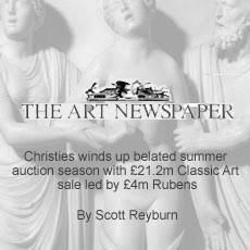 A black and white photo of a group of statues titled the art newspaper.