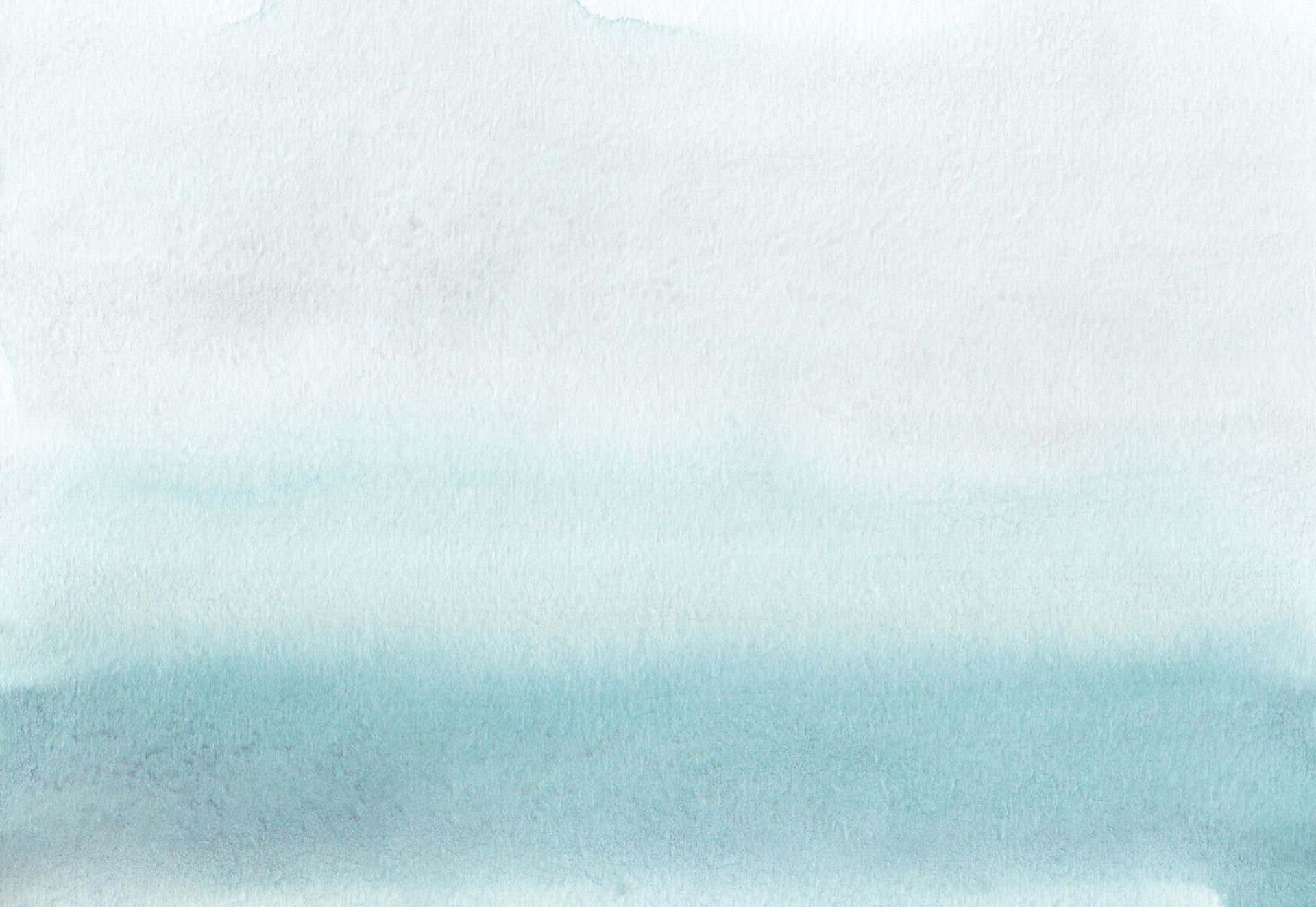 Watercolor wash in shades of teal and blue, fading from dark to light.