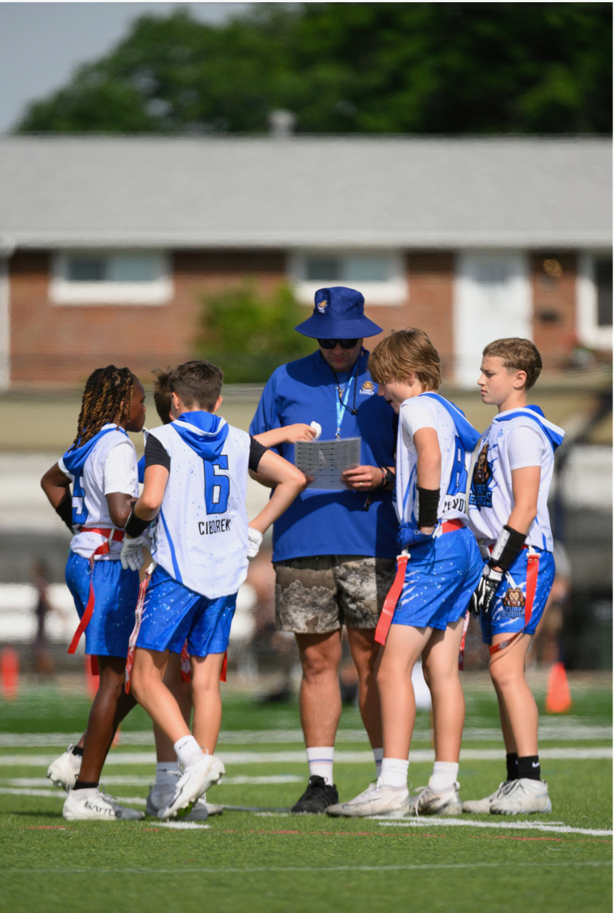 13U Boys team, huddle at practice | T3 Turf Legends Flag Football.