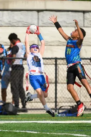 Boys, cathcing football | T3 Turf Legends Flag Football.