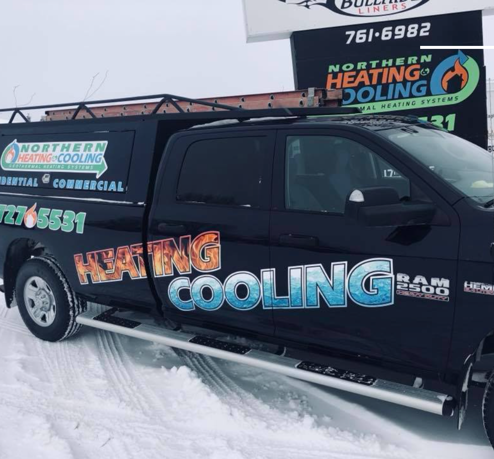A heating cooling truck is parked in the snow