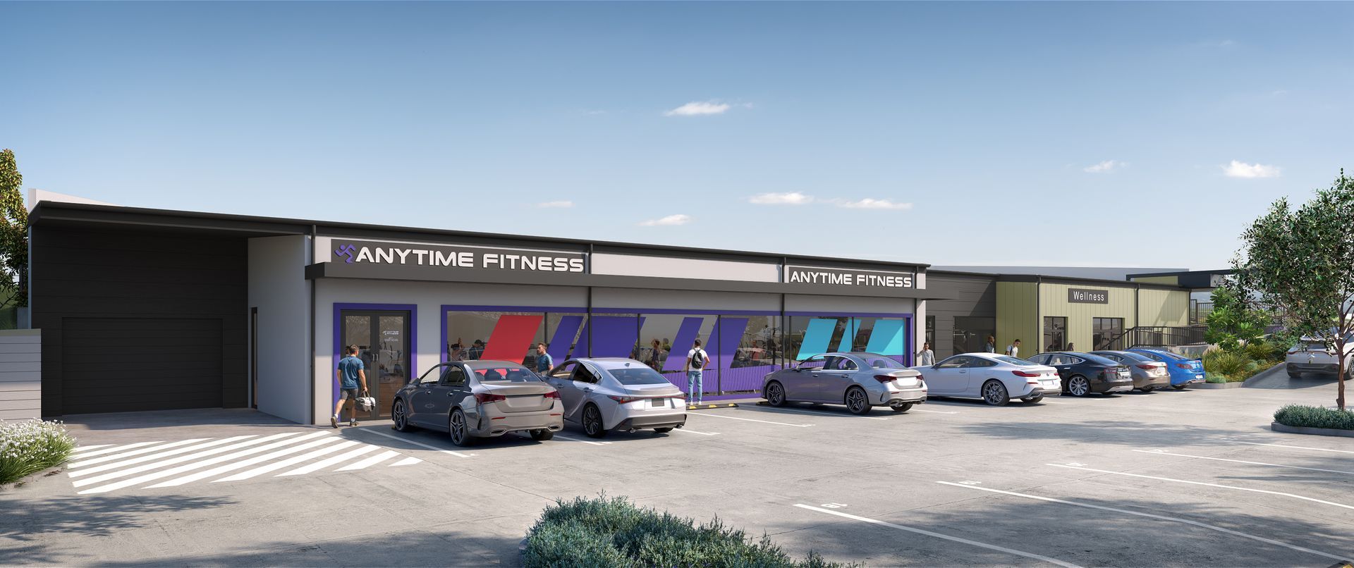 Exterior view of a gym with cars parked out front, a person near the entrance, and a clear blue sky above.