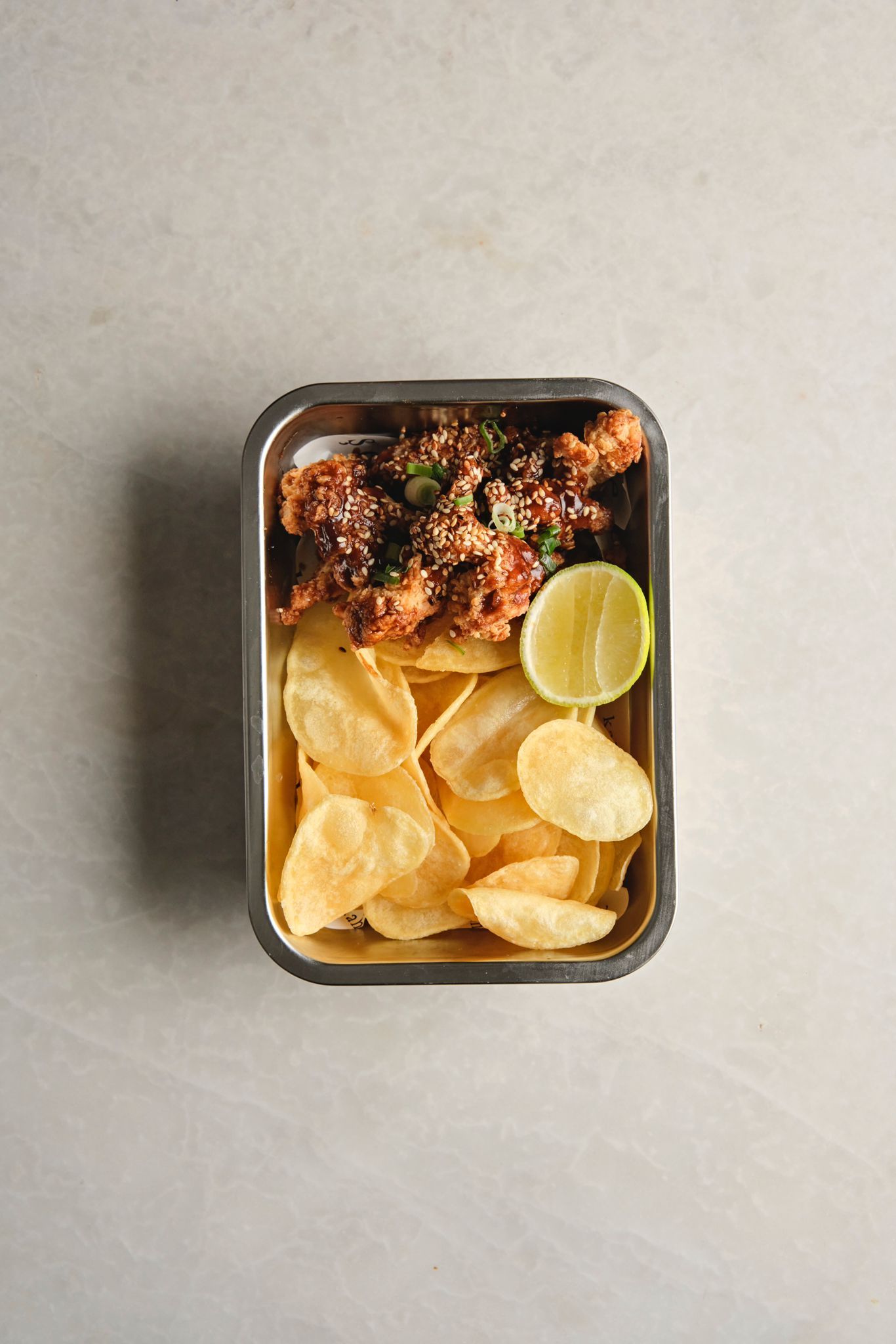 <b>crispy chicken tenders</b><br>teriyaki sauce, sesame, french fries (370 gr.)<br>980 kcal