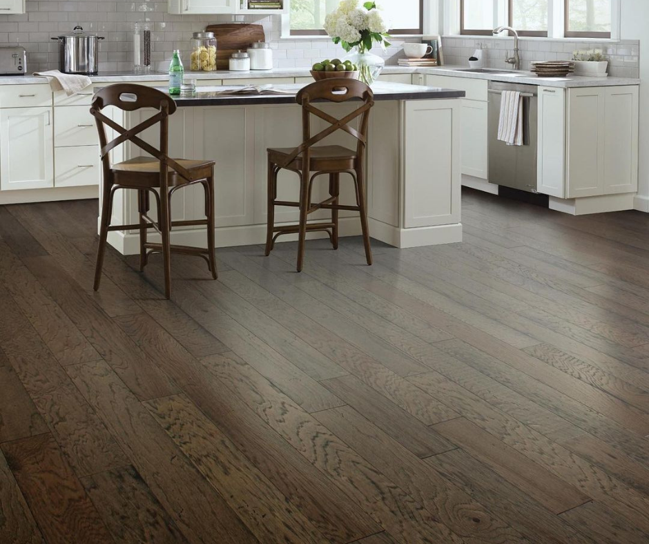 A kitchen with hardwood floors and white cabinets A kitchen with hardwood floors and white cabinets
