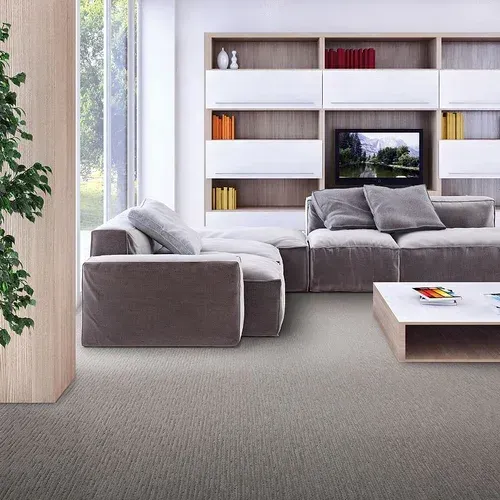 A living room with a couch a chair and a coffee table