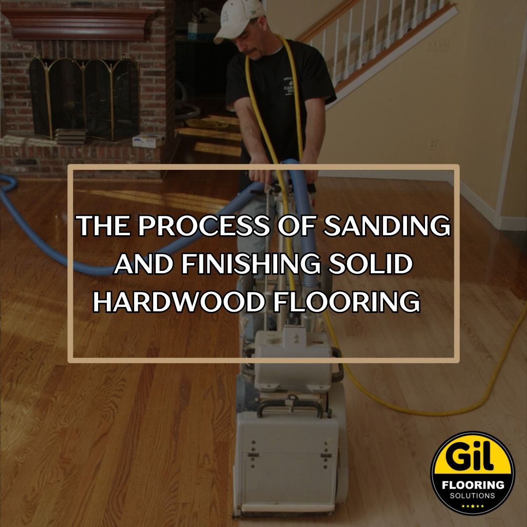A man is sanding a hardwood floor with a machine. A man is sanding a hardwood floor with a machine.
