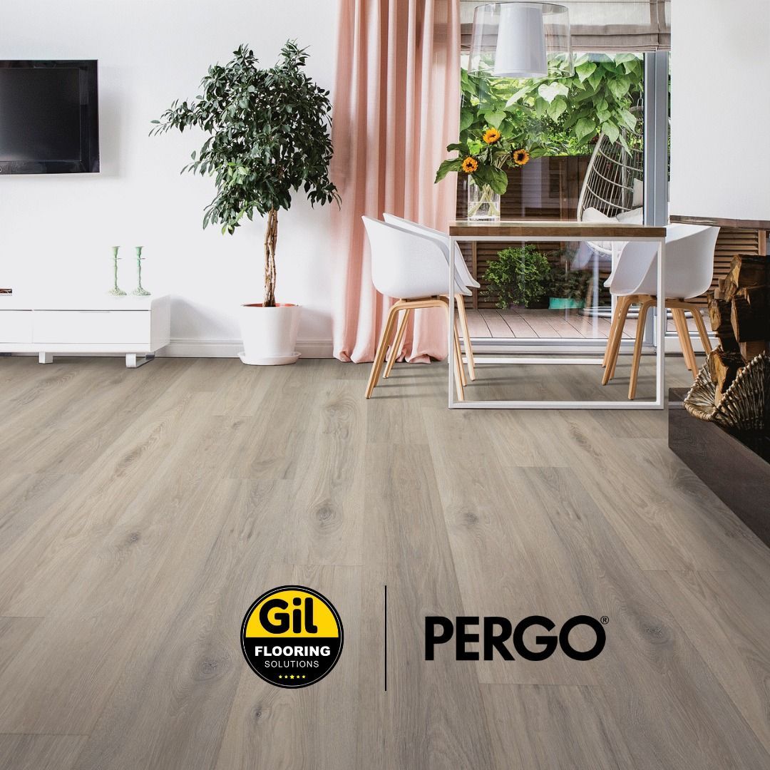 A living room with a dining table and chairs and a pergo logo on the floor