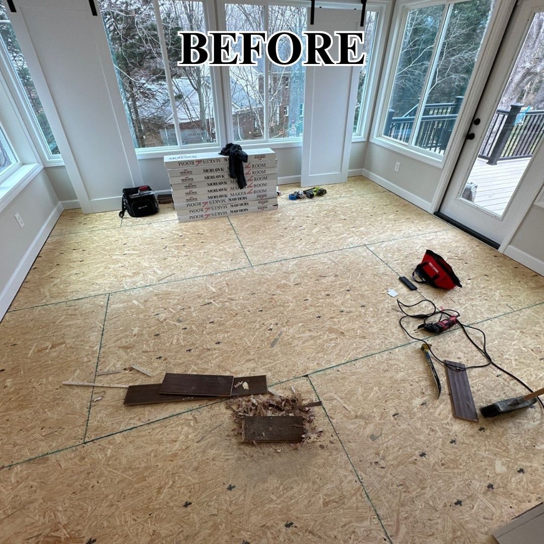 A room with a wooden floor and a lot of windows.