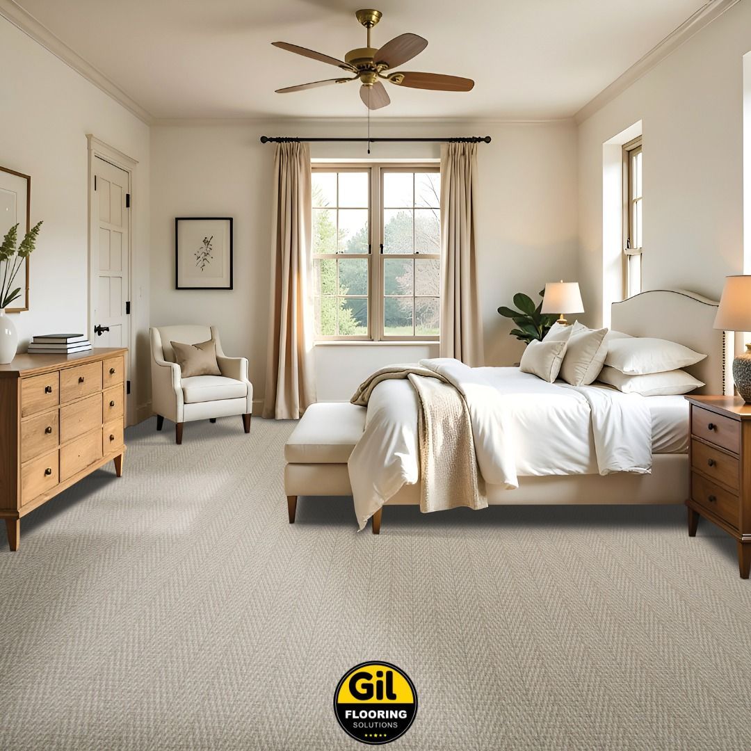 A bedroom with a bed and a ceiling fan A bedroom with a bed and a ceiling fan