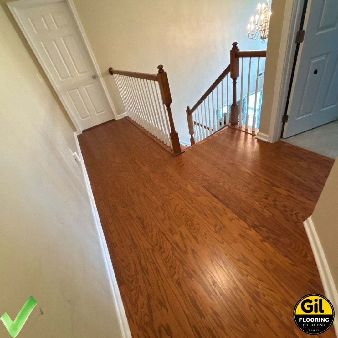 A staircase with a wooden floor and a white railing A staircase with a wooden floor and a white railing