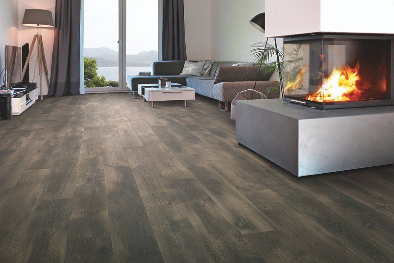 A living room with hardwood floors and a fireplace. A living room with hardwood floors and a fireplace.