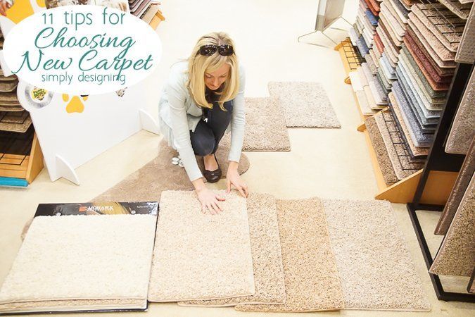 A woman is choosing a new carpet in a store