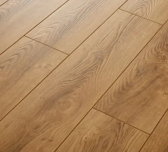 A close up of a wooden laminate floor with a diagonal pattern