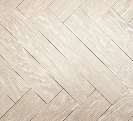 A close up of a white luxury vinyl floor.