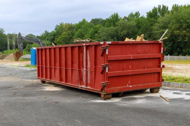 Dumpster loaded with garbage near a construction site by ABC Rolloff Dumpsters | Des Moines, IA