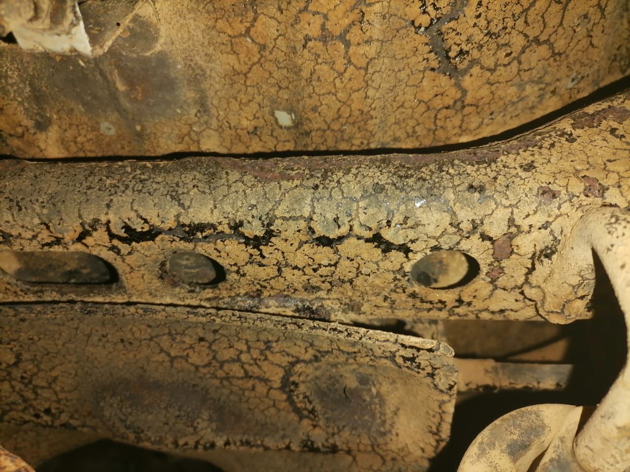 A close up of a rusty piece of metal. Prevent this by sending your vehicle to Anthony Anti-Corrosion Coatings.