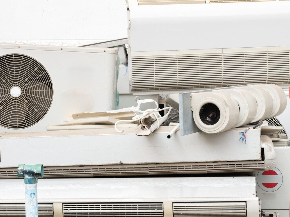 Pile of White Air Conditioning Units Stacked Up — Refrigeration & Air Supplies (South Coast) In Wollongong, NSW