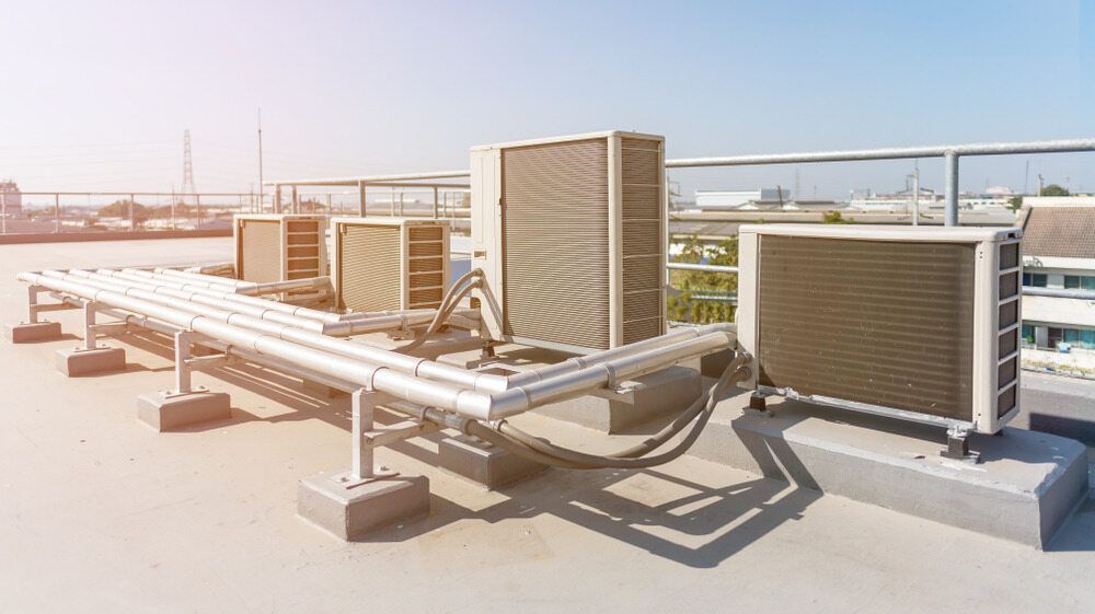 Rooftop Air Conditioning Units on a Sunny Day — Refrigeration & Air Supplies (South Coast) In South Coast, NSW