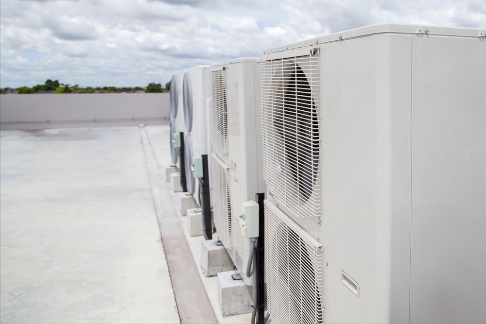 Row of White Air Conditioning Units — Refrigeration & Air Supplies (South Coast) In Wollongong, NSW