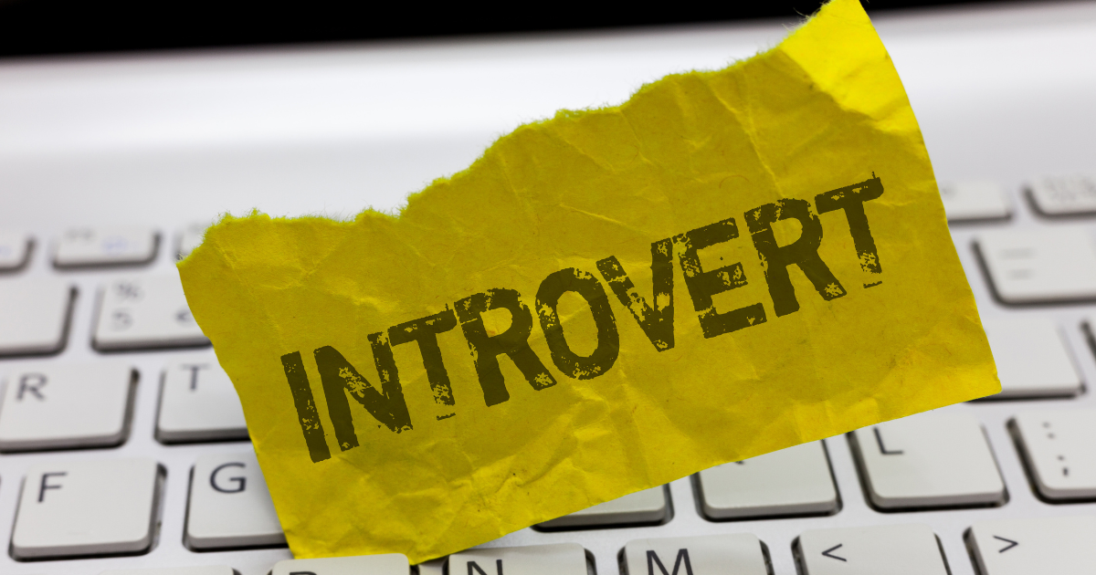 A piece of paper with the word introvert written on it