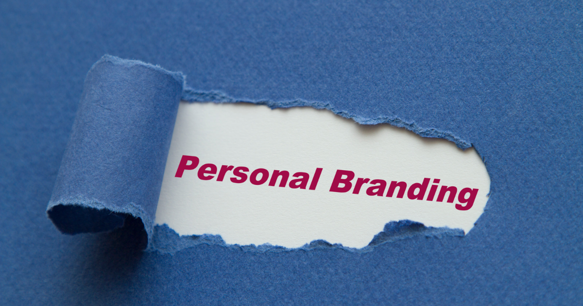 A piece of torn paper with the words personal branding written on it