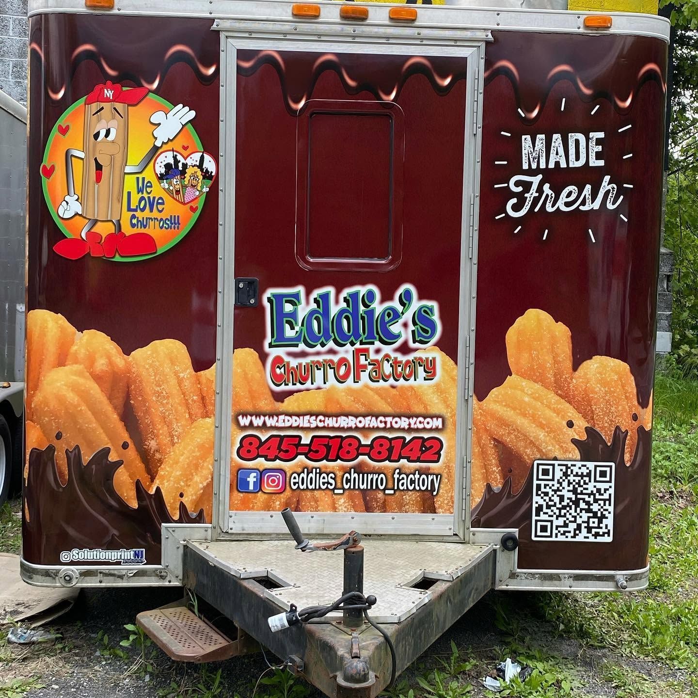 Eddie’s Churro Factory food trailer with maroon panels, churro graphics, and “Made Fresh” sign