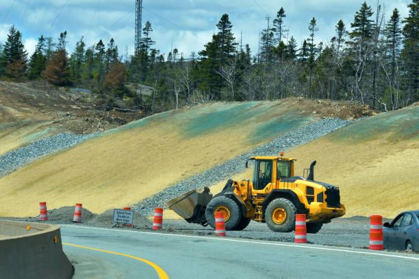 Access ramp construction and hydroseeding