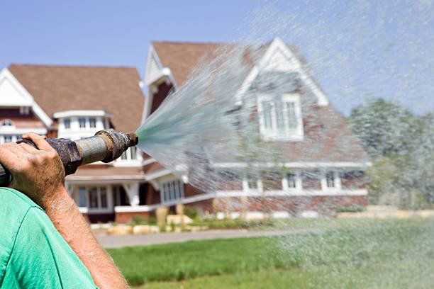 Hydroseed watering a new lawn